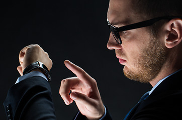 Image showing close up of businessman with smart watch