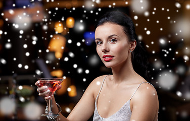 Image showing glamorous woman with cocktail at night club or bar