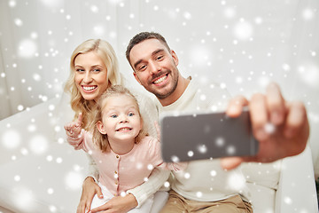 Image showing family taking selfie with smartphone at home