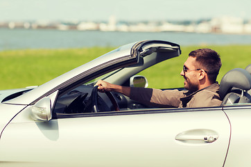 Image showing happy man driving cabriolet car outdoors