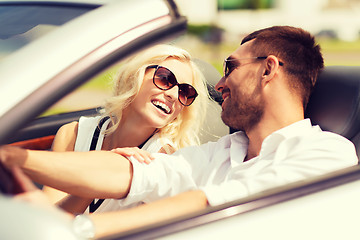 Image showing happy man and woman driving in cabriolet car