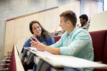 Image showing group of students with notebooks at lecture hall