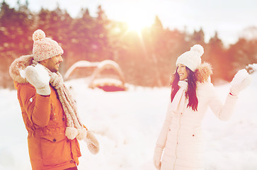 Image showing happy couple playing snowballs in winter