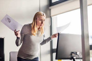 Image showing pregnant businesswoman stressing at office work