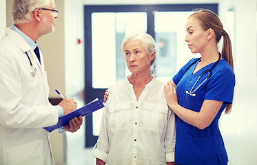 Image showing medics and senior patient woman at hospital