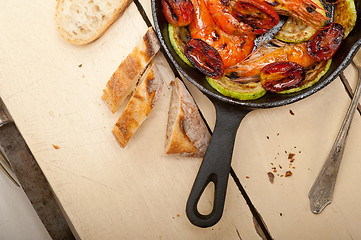 Image showing roasted shrimps with zucchini and tomatoes