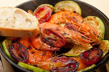 Image showing roasted shrimps with zucchini and tomatoes