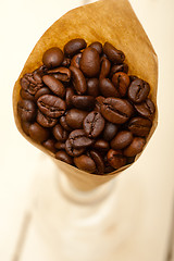 Image showing espresso coffee beans on a paper cone