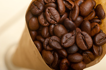 Image showing espresso coffee beans on a paper cone