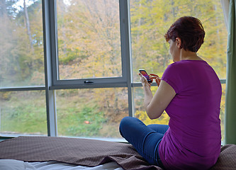 Image showing Woman using her smartphone 