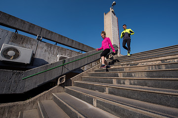 Image showing young  couple jogging on steps