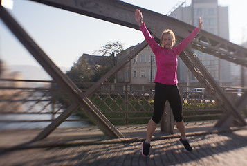 Image showing woman  stretching before morning jogging