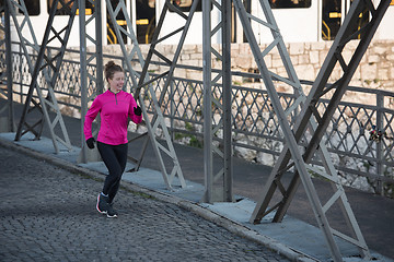 Image showing sporty woman jogging on morning