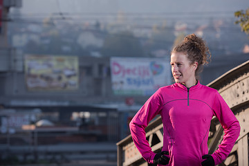 Image showing woman  stretching before morning jogging