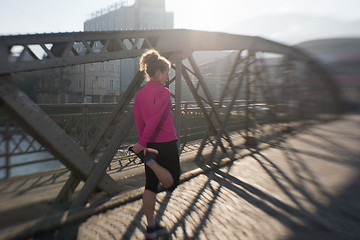 Image showing sporty woman jogging on morning