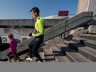 Image showing young  couple jogging on steps