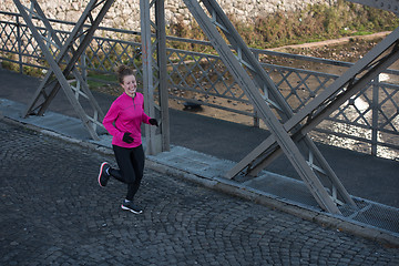 Image showing sporty woman jogging on morning