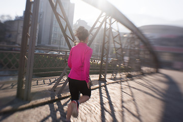 Image showing sporty woman jogging on morning