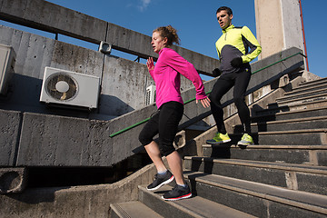 Image showing young  couple jogging on steps