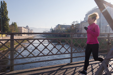 Image showing sporty woman jogging on morning