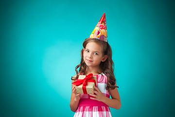 Image showing The cute cheerful little girl on blue background