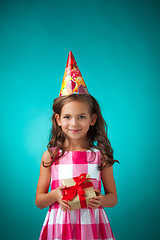 Image showing The cute cheerful little girl on blue background