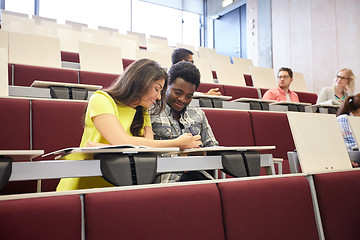 Image showing group of students with notebooks at lecture hall