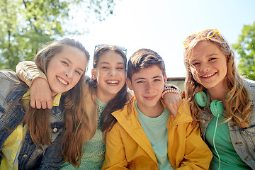 Image showing happy teenage students or friends outdoors