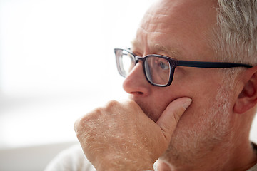 Image showing close up of senior man in glasses thinking