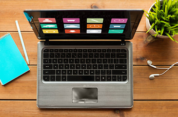 Image showing close up of laptop computer on wooden table