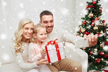 Image showing family taking selfie with smartphone at christmas