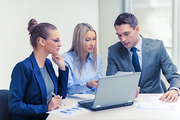 Image showing business team with laptop having discussion