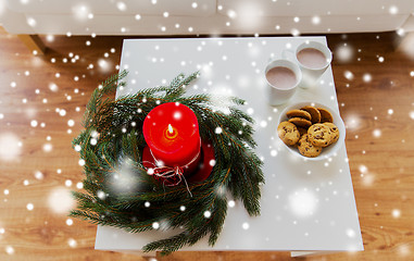 Image showing close up of christmas wreath with candle on table