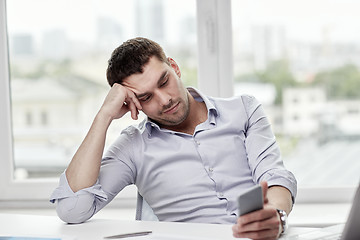 Image showing  businessman with smartphone  at office 