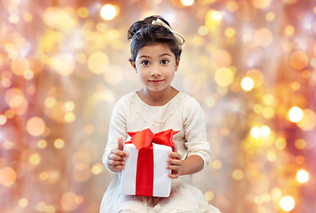 Image showing smiling little girl with gift box