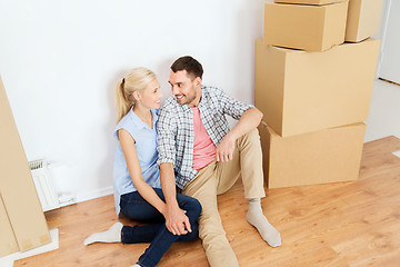 Image showing couple with cardboard boxes moving to new home