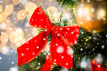 Image showing close up of red bow decoration on christmas tree