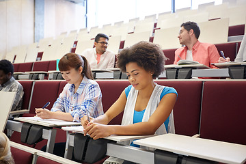 Image showing group of students with notebooks at lecture hall