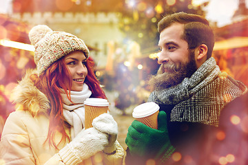 Image showing happy couple drinking coffee on old town street