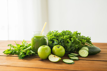 Image showing close up of jug with green juice and vegetables