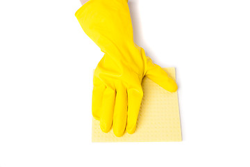 Image showing Arm in rubber gloves removes dust