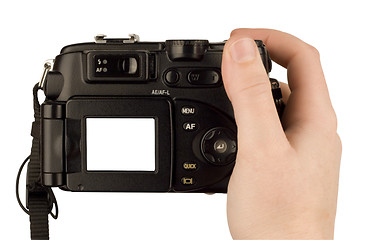 Image showing Digital Camera photo in a hand isolated on withe background. lcd screen and background can be easily edited