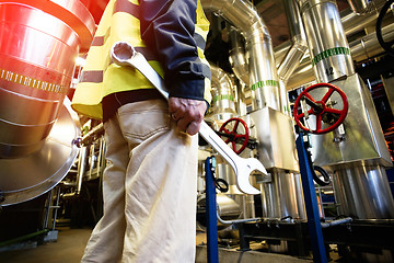 Image showing industrial worker with spanner at factory workshop