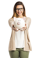 Image showing Woman holding piggybank