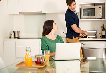 Image showing Young couple on the kitchen