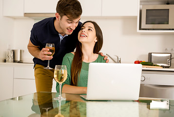 Image showing Young couple on the kitchen