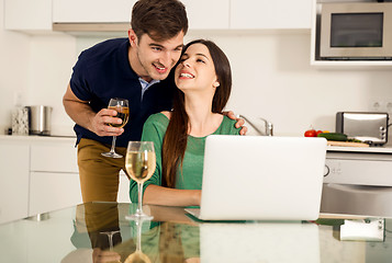 Image showing Young couple on the kitchen