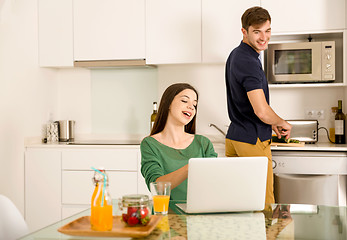 Image showing Young couple on the kitchen