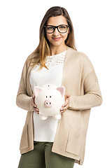 Image showing Woman holding piggybank