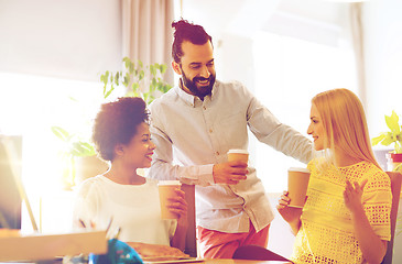 Image showing business team with coffee cups talking at office